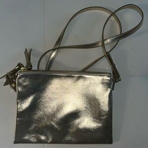 Mini gold purse. Cute for a little outdoor fun.